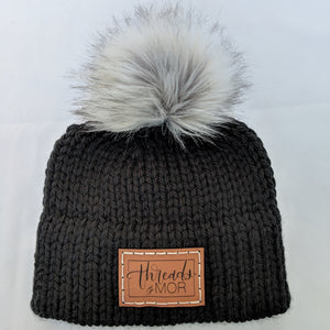 Black double brim knit hat with silver fox faux fur pompom