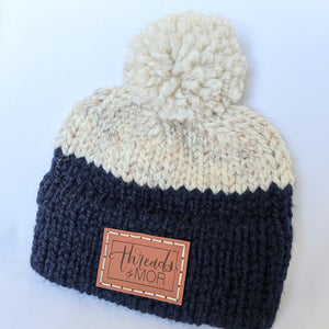 Navy and wheat double brim knit hat with yarn pompom