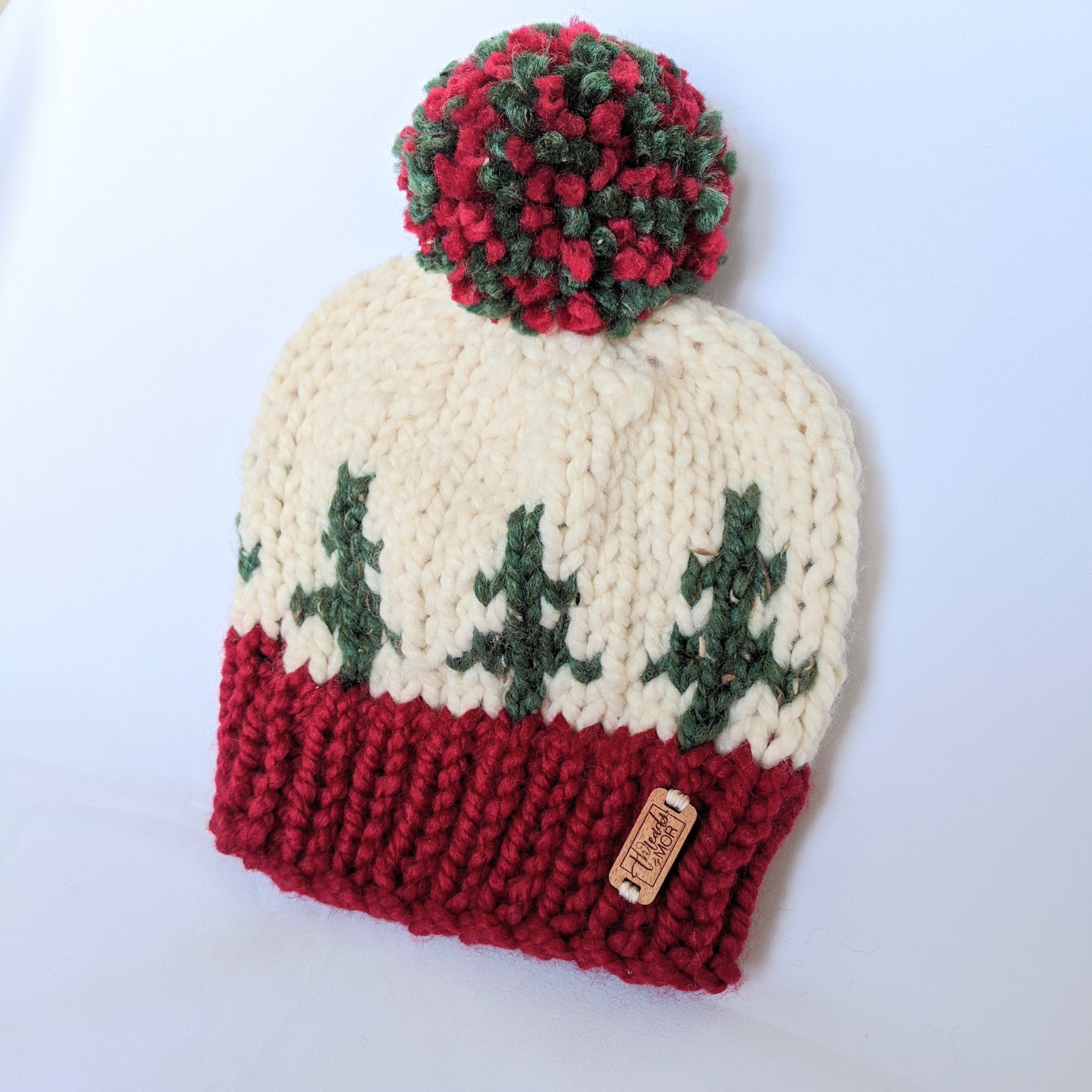 Holiday Spirit knit hat with yarn pompom