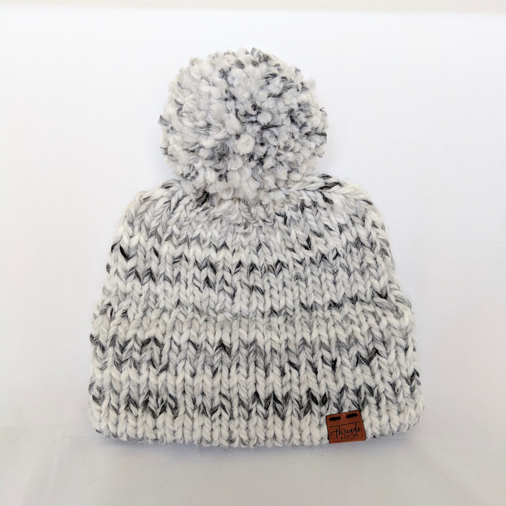 White and gray stripped double brim knit hat with yarn pompom