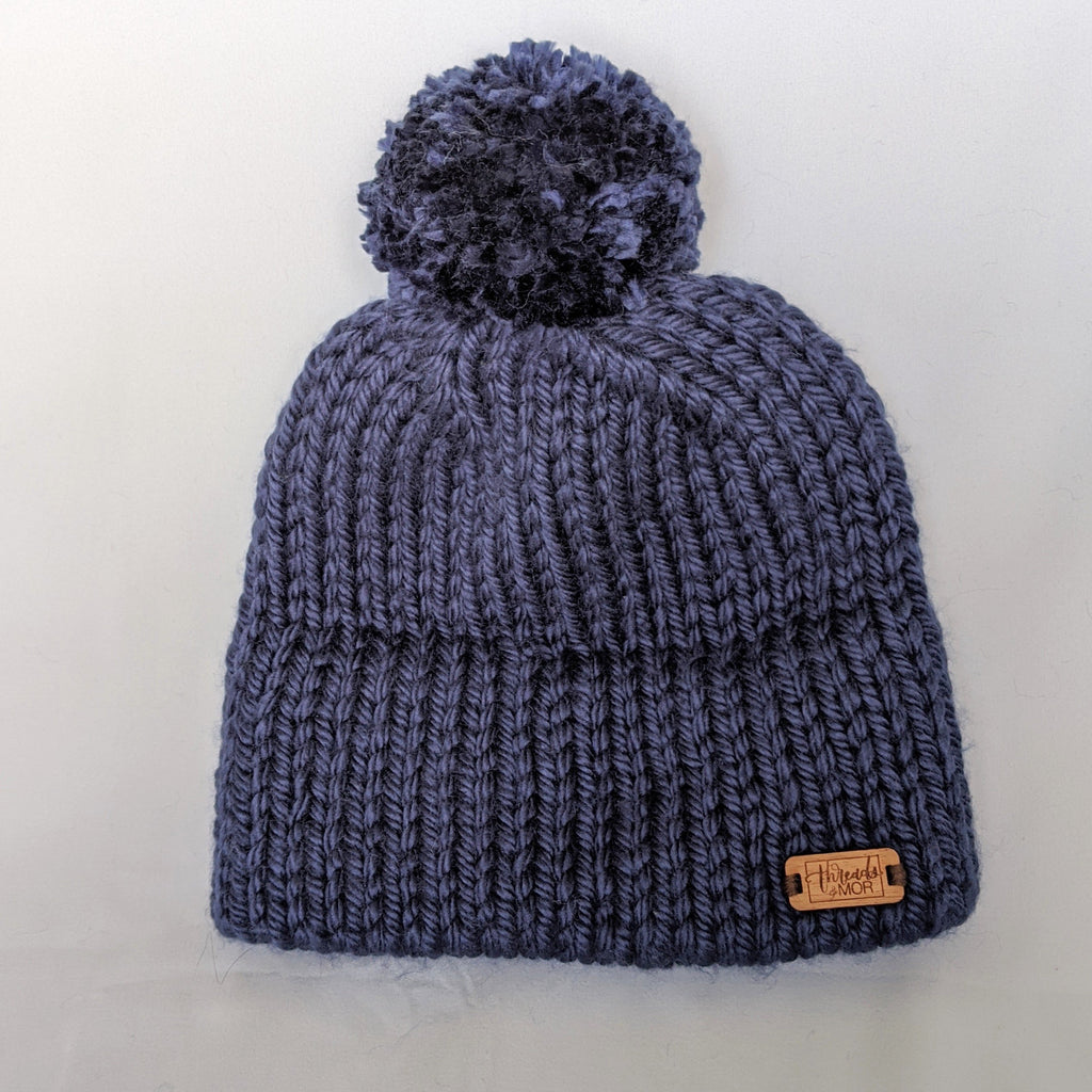 Navy double brim knit hat with yarn pompom