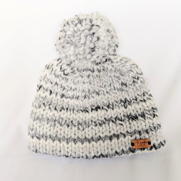White and gray stripped double brim knit hat with yarn