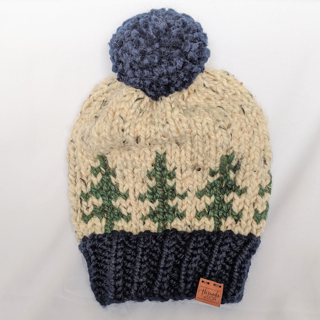 Evergreen slouchy knit hat with yarn pompom