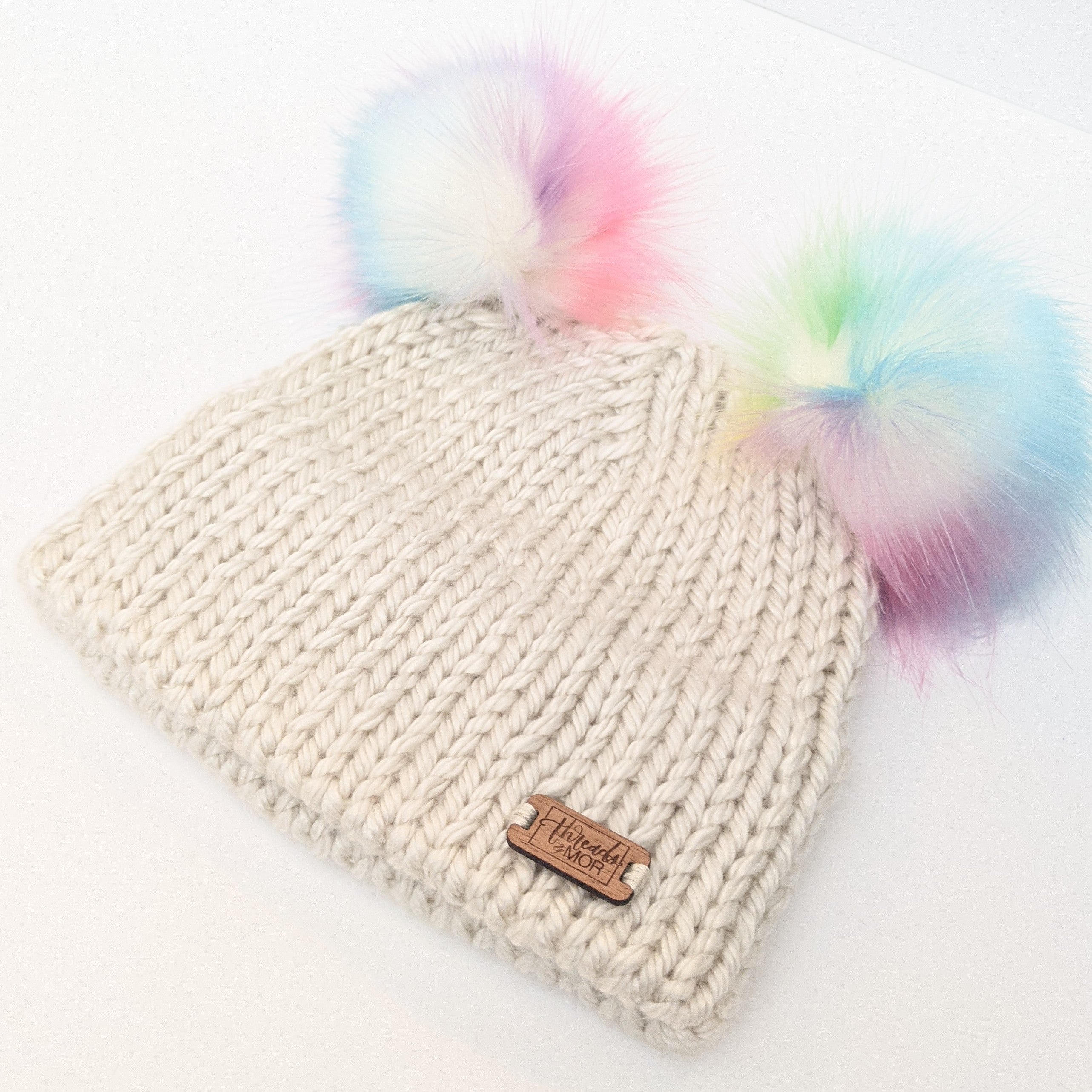 Youth double brim knit hat with two Unicorn Faux Fur pompom